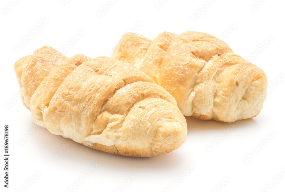 Two baked croissants or cornetto isolated on white background. Two baked croissants or cornetto isolated on white background.