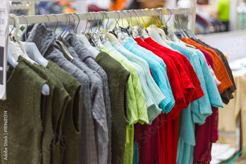 woman clothes on hangers for sale in market Thailand 