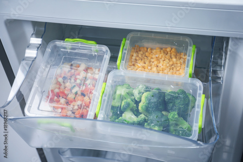 Frozen vegetables in refrigerator icebox