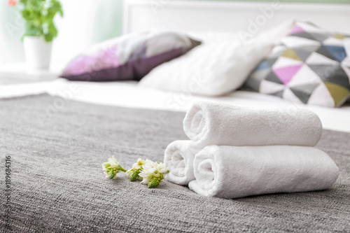 Fototapeta Naklejka Na Ścianę i Meble -  Clean soft towels on bed
