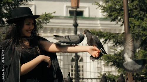 Wallpaper Mural Beautiful girl walking in the Park and feeding pigeons. Torontodigital.ca