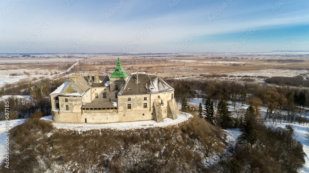 Obraz premium Aerial view of the Olesky Castle and residential neighborhoods near it