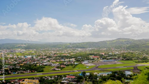 Panorama of the city of Legazpi on the background of the airport. Luzon, Philippines. Timelapse. photo