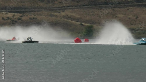 Speed boats racing on lake