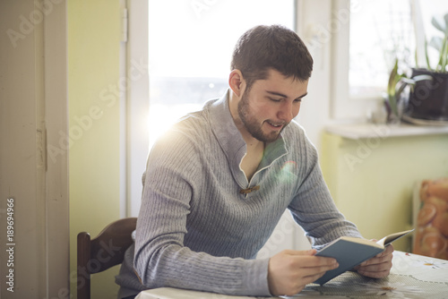 Young teenager reading a good book