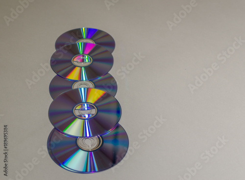 A set of compact disks lying horizontally photo