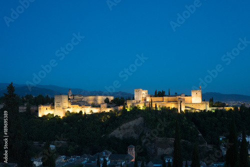 The magnificient Alhambra of Granada, Spain. Alhambra fortress at sunset viewed from Mirador de San Nicolas