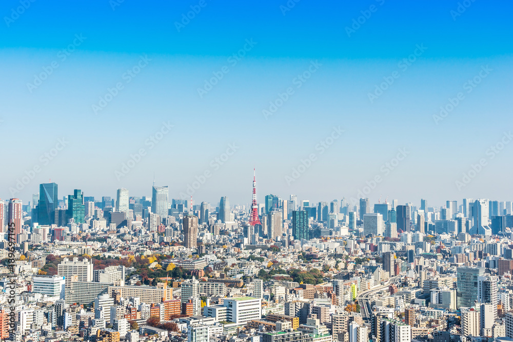 Fototapeta premium Asia Business concept for real estate and corporate construction - panoramic modern city skyline bird eye aerial view of tokyo tower under blue sky in Tokyo, Japan