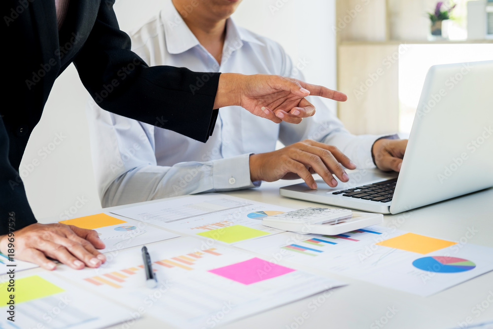 Administrator business man financial inspector and secretary making report, calculating balance. Internal Revenue Service checking document. Audit concept. Administrator business man financial inspector and secretary making report, calculating balance. Internal Revenue Service checking document. Audit concept.