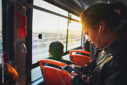 Young asian woman in bus at morning