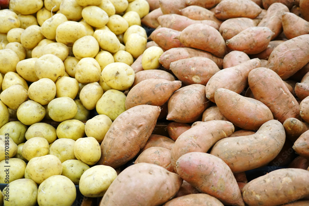 Potato and sweet potato in the grocery store for sale Potato and sweet potato in the grocery store for sale