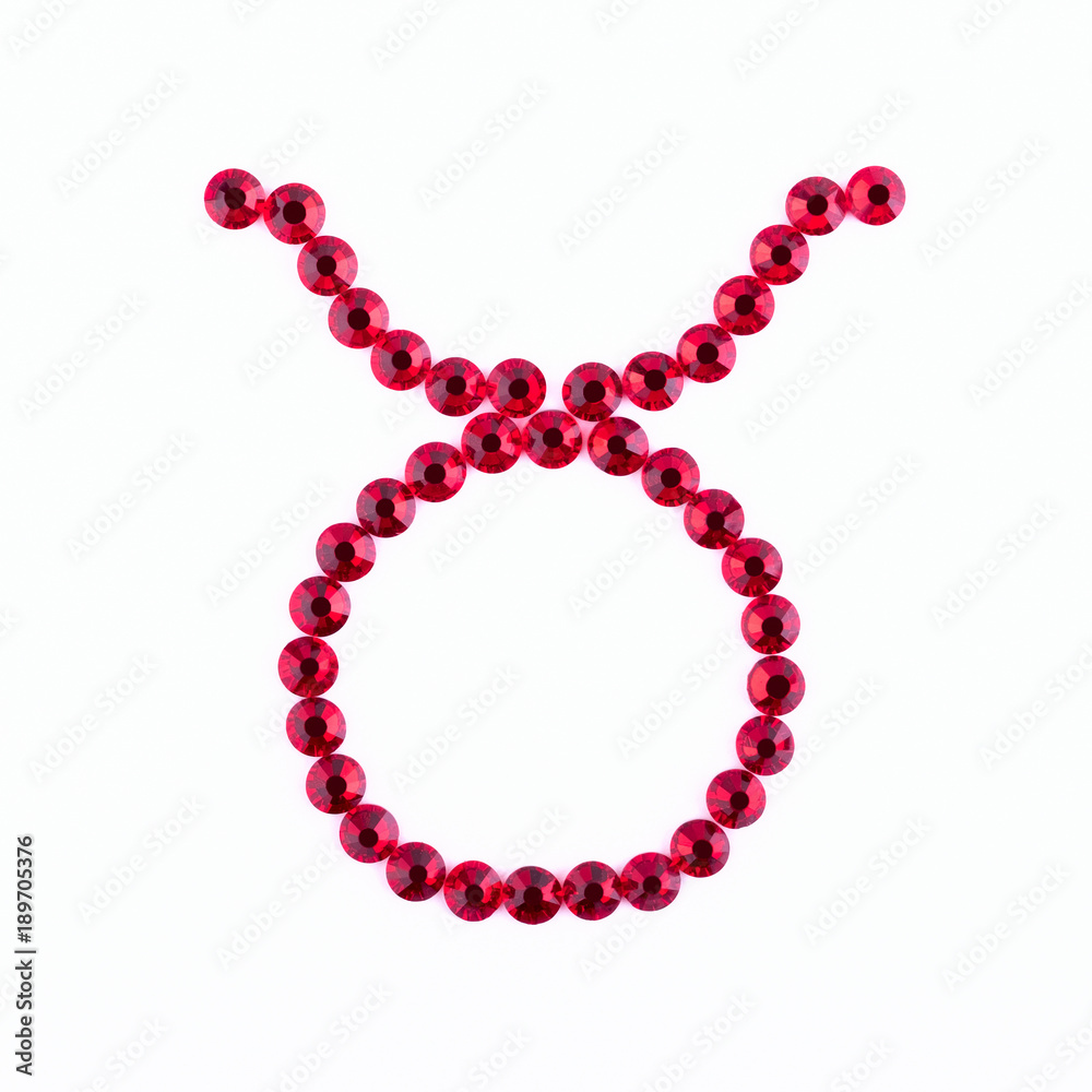 Taurus. Sign of the zodiac of red rhinestones on a white background. Taurus. Sign of the zodiac of red rhinestones on a white background.