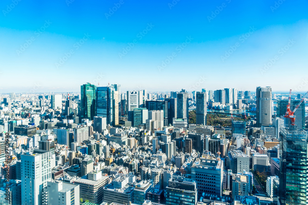 Asia Business concept for real estate and corporate construction - panoramic modern city skyline bird eye aerial view with crane near tokyo tower under bright sun and vivid blue sky in Tokyo, Japan Asia Business concept for real estate and corporate construction - panoramic modern city skyline bird eye aerial view with crane near tokyo tower under bright sun and vivid blue sky in Tokyo, Japan