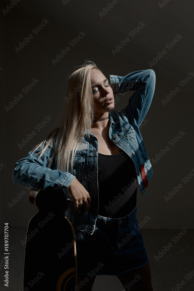 Beautiful blond girl posing with a loangboard Beautiful blond girl posing with a loangboard