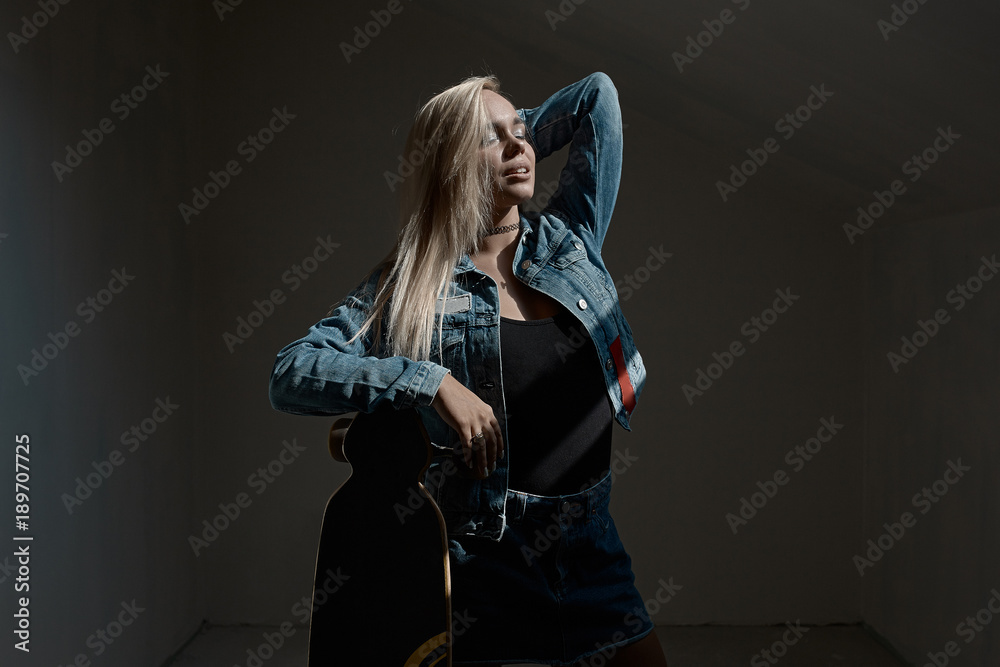 Beautiful blond girl posing with a loangboard Beautiful blond girl posing with a loangboard