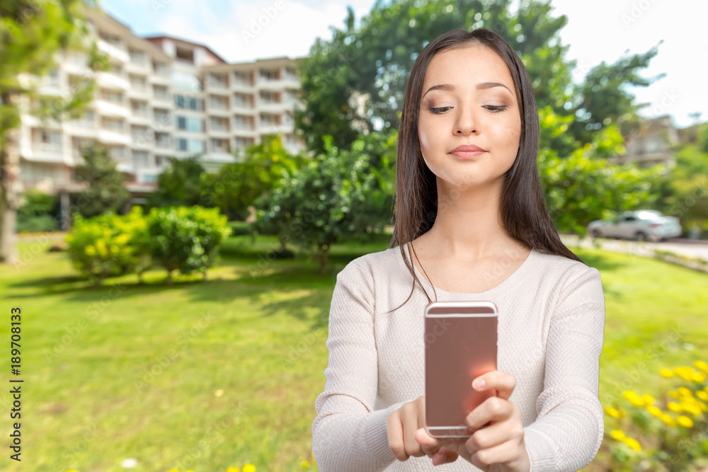 Joyful young women making selfie by her smart phone Joyful young women making selfie by her smart phone