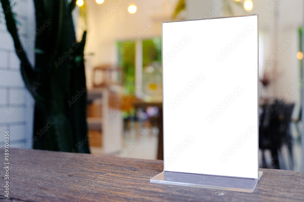 Mock up Menu frame standing on wood table in Bar restaurant cafe. space for text Mock up Menu frame standing on wood table in Bar restaurant cafe. space for text