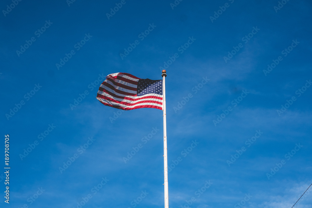american flag soaring in the wind