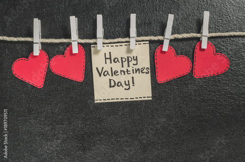 Photography Cut out of red paper hearts hang on the rope on the little primako, greetings ha