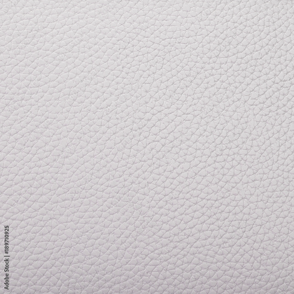 A piece of grayish artificial leather texture closeup A piece of grayish artificial leather texture closeup