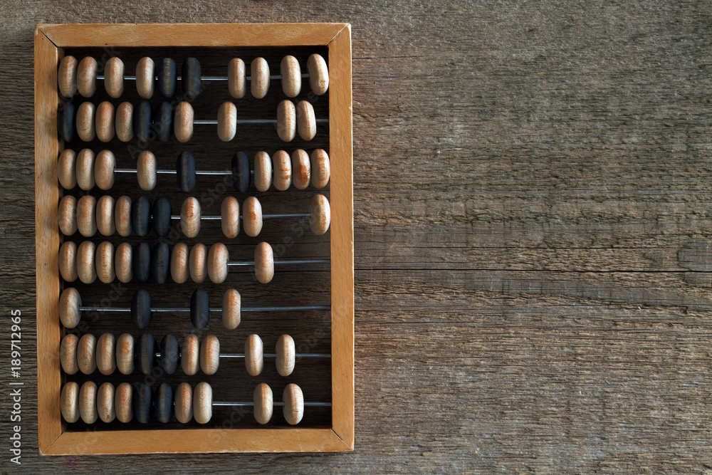 Wooden abacus on an old wooden table Wooden abacus on an old wooden table