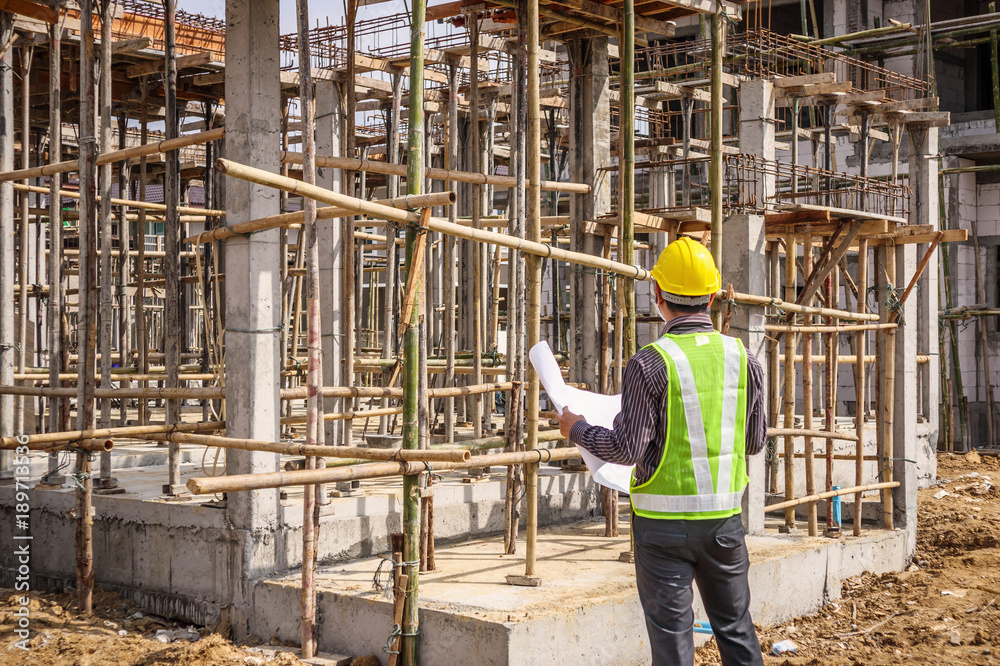 Asian business man construction engineer worker at house building site