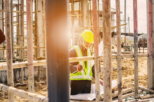 Asian business man construction engineer worker at house building site