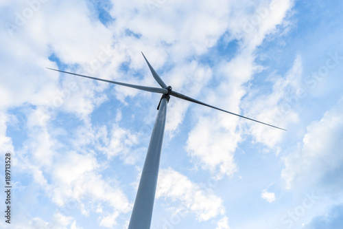 Wind Turbines in Wind Farm with Cloudy Blue Sky at Khao Kho District of Phetchabun Province, Thailand.