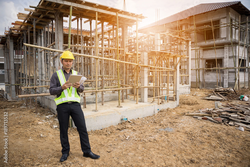 construction engineer worker using tablet computer at building site