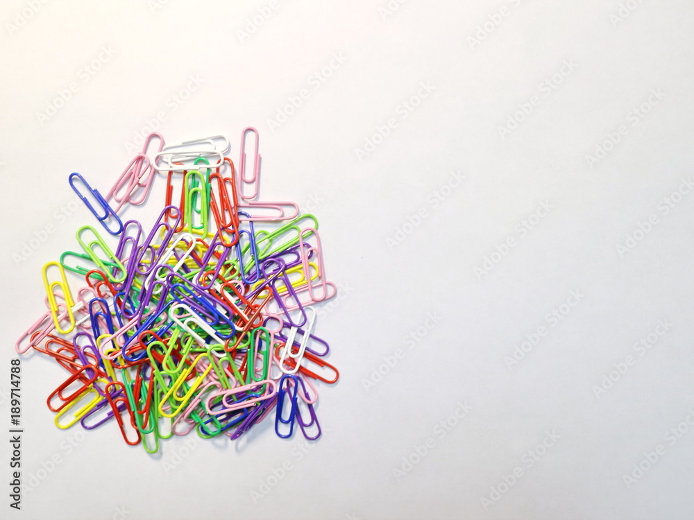 office paper clips of different colors on the desk office paper clips of different colors on the desk