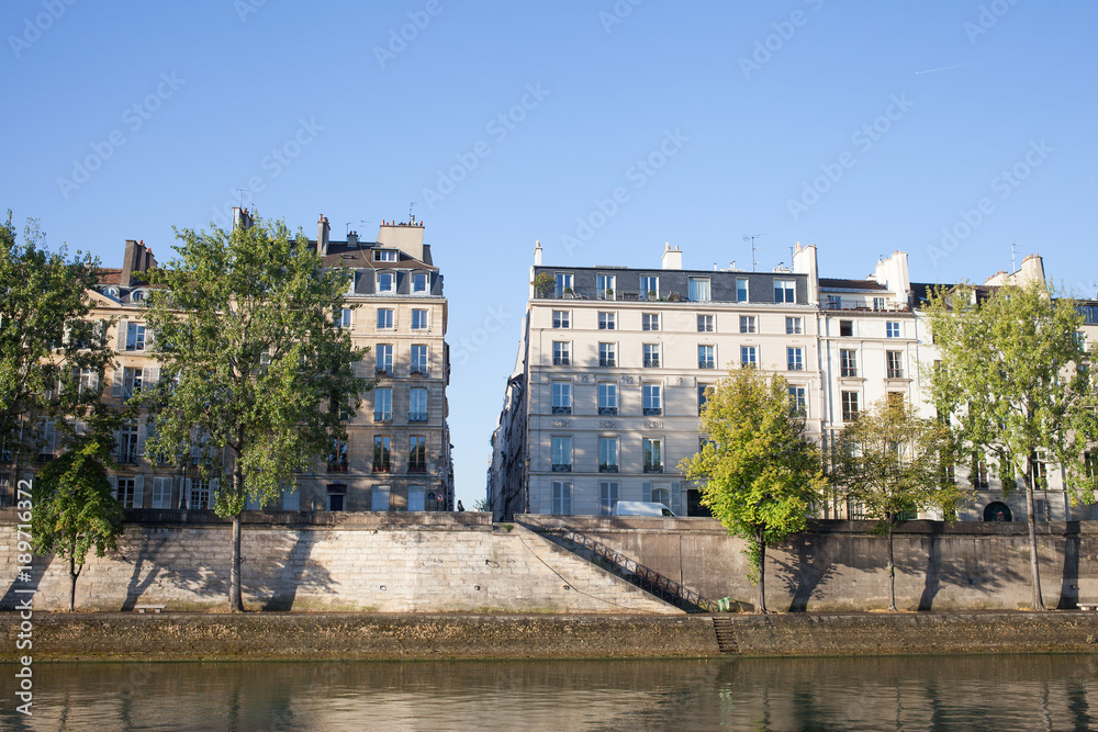 Seine river embankment in morning, Paris, France.