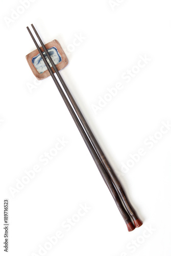 Two chopsticks on on white background 
