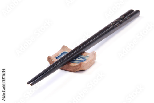 Two chopsticks on on white background 