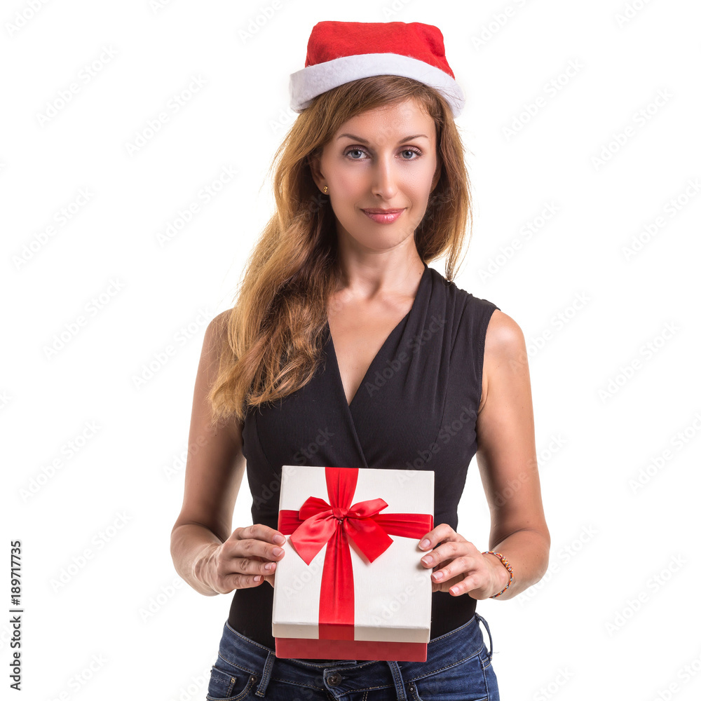 Beautiful caucasian wearing red christmas hat and holding new year gift box. Studio shooting isolated on white Beautiful caucasian wearing red christmas hat and holding new year gift box. Studio shooting isolated on white
