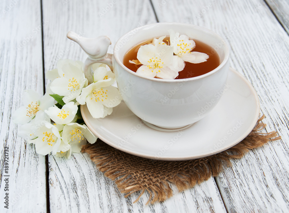 Cup of tea with jasmine flowers Cup of tea with jasmine flowers