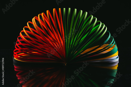 colored quilling paper curves on black