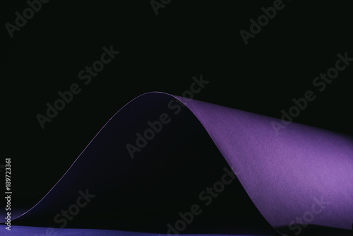 warping simple purple paper on black