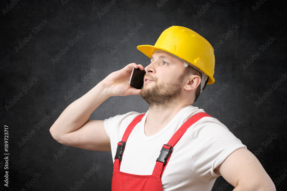 Construction worker using smartphone