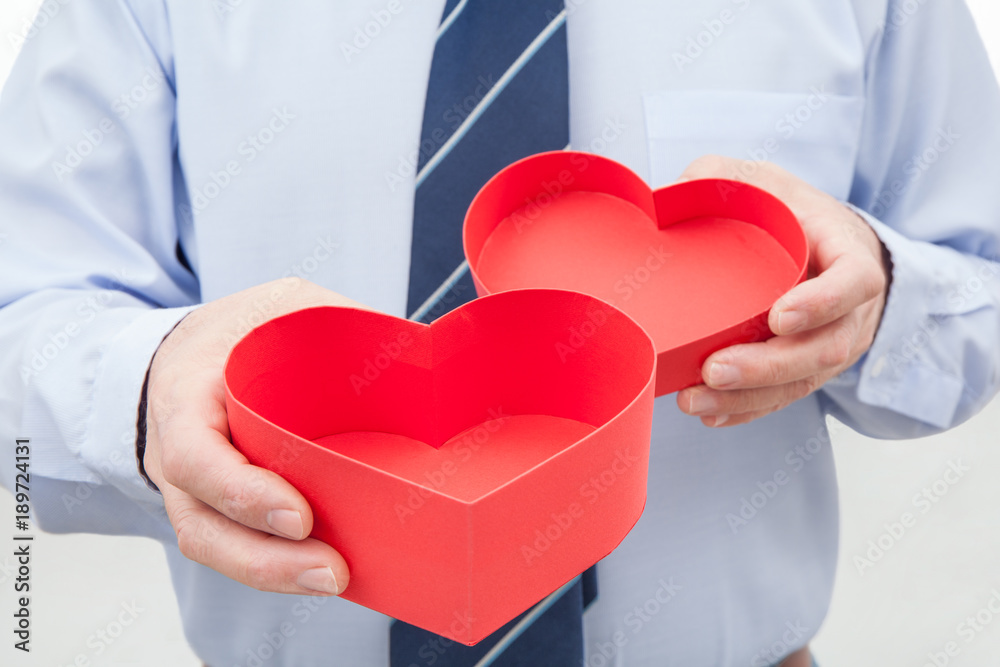 Man with Red Gift Box in Hands