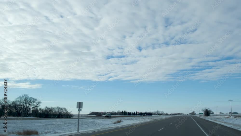 180° pan from inside a car driving down a snowy road in the prairies.
Flat fields and huge skies. 180° pan from inside a car driving down a snowy road in the prairies.
Flat fields and huge skies.