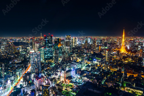 Asia Business concept for real estate   corporate construction - panoramic modern city skyline view of Tokyo Metropolitan Expressway junction with neon night in Roppongi Hill  Tokyo  Japan