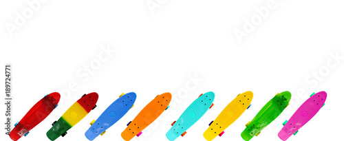 Collection of colorful skateboards isolated on white background with copy space, horizontal image