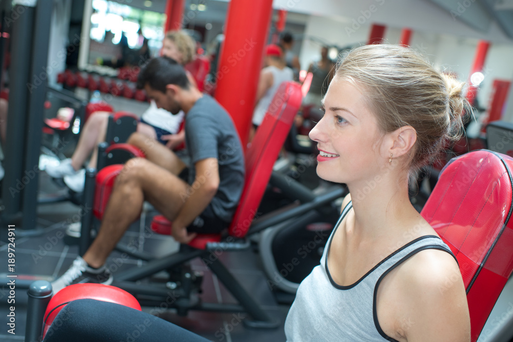 woman doing leg exercise in the gym woman doing leg exercise in the gym
