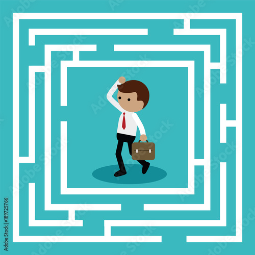Businessman standing in center of the maze