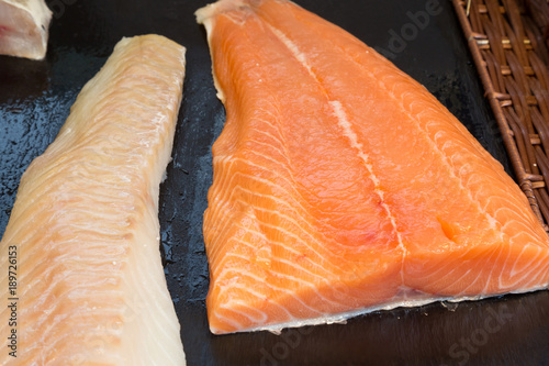 Fresh fillet of salmon and cod at a fishmonger