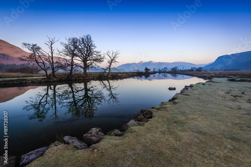 Dawn reflections on the river Derwent, The Lake District, Cumbria, England