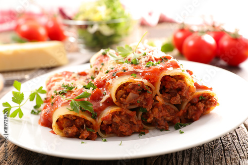 canneloni with beef and tomato sauce photo
