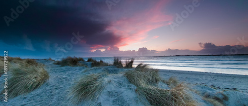 Storm Clouds at sunset over West Wittering Beach, West Sussex, UK photo