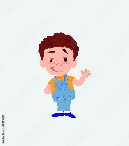 White boy in jeans waving with a dreamy expression.
