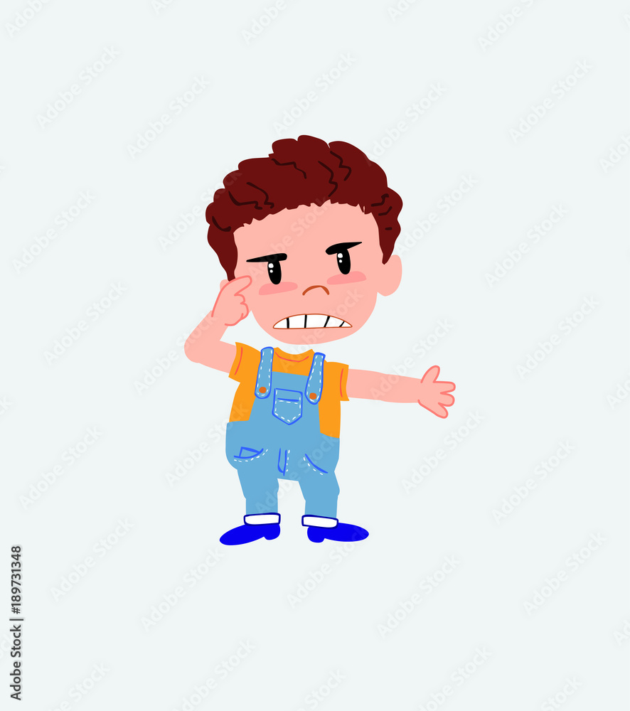White boy in jeans, is angry and points his head with his index finger. White boy in jeans, is angry and points his head with his index finger.